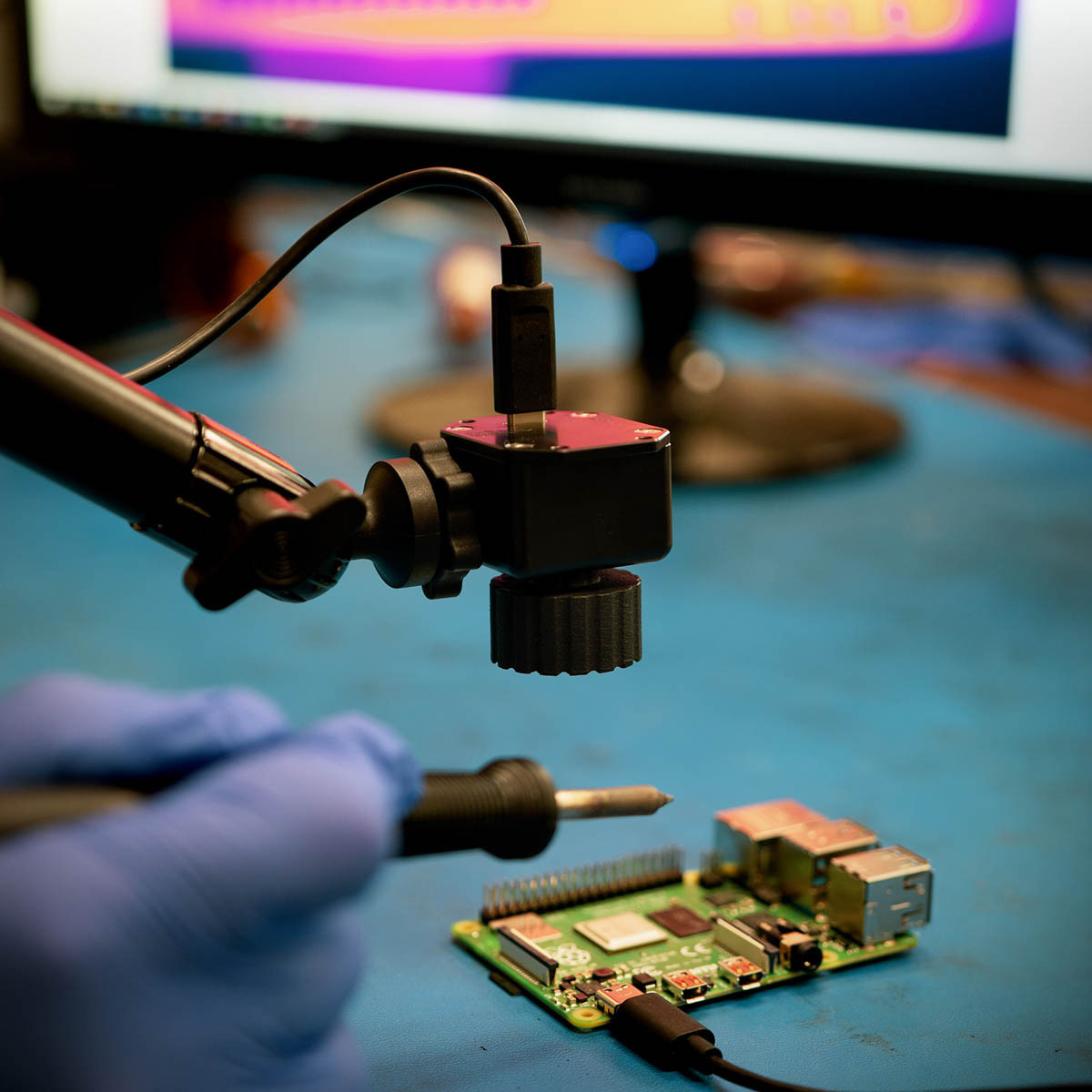 The Seek Thermal InspectionCAM Thermal Camera being used by an operative to work on a miniture circuit board.